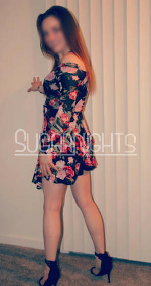 Michigan escort Brielle Rose poses in a colorful floral dress. Michigan escort Brielle Rose poses in a colorful floral dress.